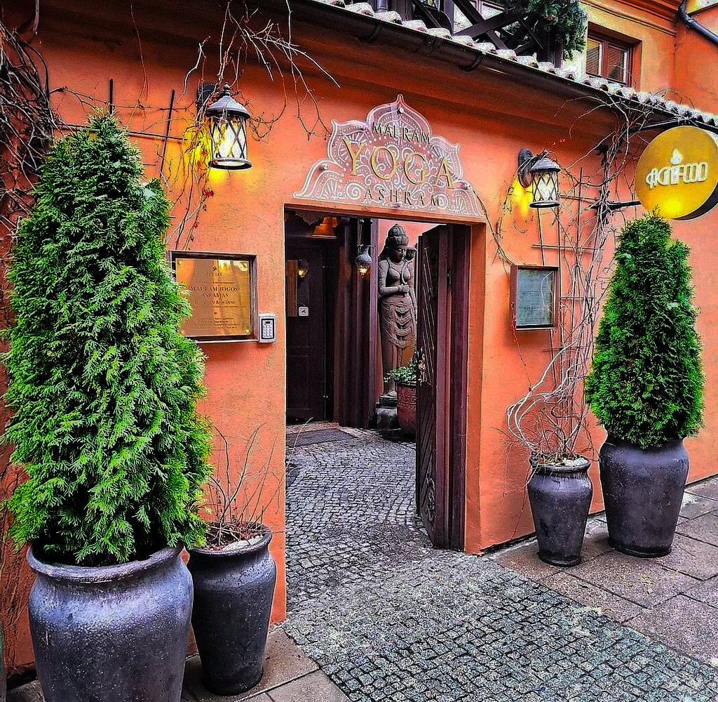 AgniFood restaurant entrance — Indian-inspired orange facade with terracotta pots